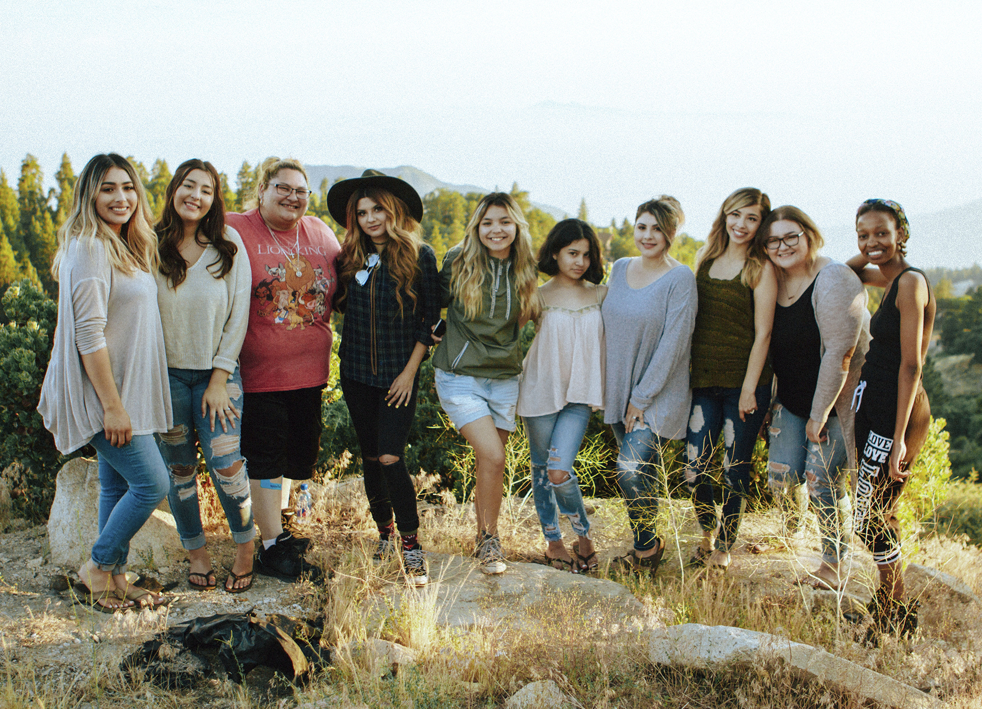 Team of smiling people at an outdoor retreat